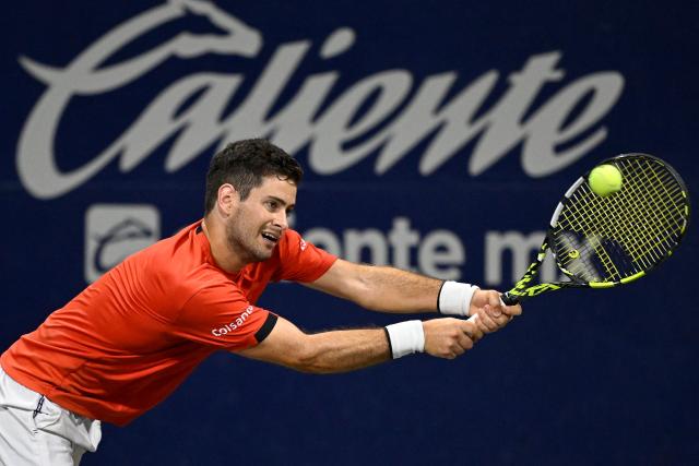 Colombia's Nicolas Mejia returns the ball to US' Nishesh Basavareddy during the Mexico ATP Open men's singles tennis match at the Cabo Sports Complex in Los Cabos, Baja California, Mexico on July 15, 2025. (Photo by Alfredo ESTRELLA / AFP)