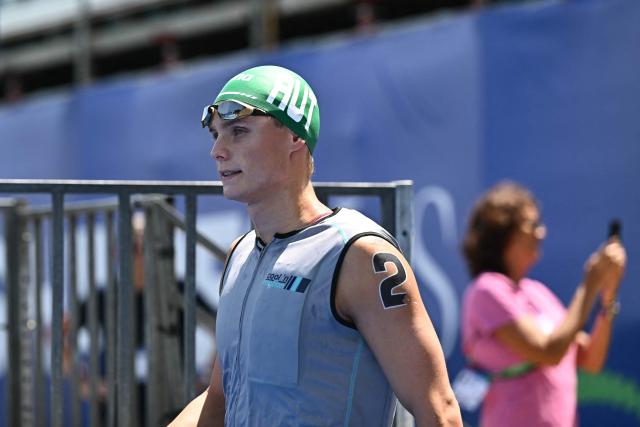 Austria's swimmer Luca Karl arrives for the final of the men's 10km open water swimming event during the 2025 World Aquatics Championships at Sentosa Island in Singapore on July 16, 2025. (Photo by Manan VATSYAYANA / AFP)