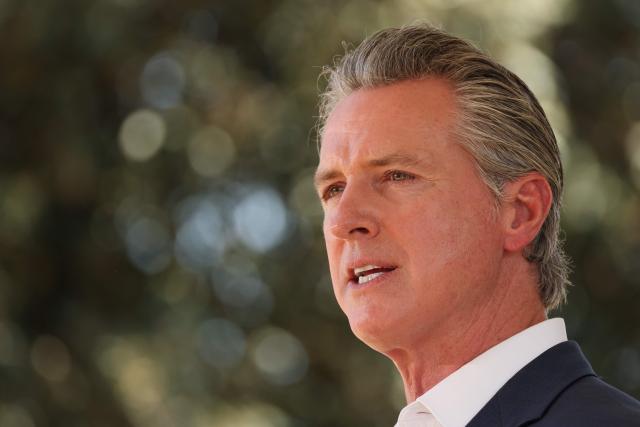California Governor Gavin Newsom holds a news conference at Downey Memorial Christian Church in Downey, California, on July 16, 2025. Newsom discussed the US Defense Department's decision to order the withdrawal of 2,000 National Guard troops from Los Angeles, roughly halving the contentious deployment in the city. President Donald Trump ordered thousands of National Guard and hundreds of Marines into Los Angeles last month in response to protests over federal immigration sweeps -- a move opposed by city leaders and California's Democratic Governor Gavin Newsom. (Photo by Patrick T. Fallon / AFP)