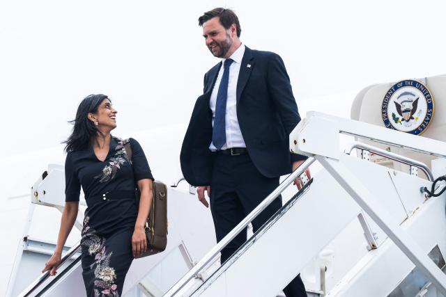 US Vice President JD Vance and his wife Usha Vance step off Air Force Two at Joint Base Andrews, Maryland, on July 16, 2025. Vance traveled to West Pittston, Pennsylvania, for an event touting the "One Big Beautiful Bill Act," containing spending and tax policies, recently passed by Congress and signed into law by President Donald Trump. (Photo by SAUL LOEB / POOL / AFP)
