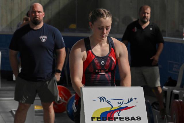 US' Olivia Lynn is pictured warming up before the 69 kg category during the 2025 Pan American Weightlifting Championships at Miguel Calero Coliseum in Cali, Colombia on July 16, 2025. (Photo by JOAQUIN SARMIENTO / AFP)