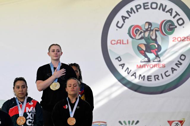US' Olivia Lynn (2nd-L), Colombia's Julieth Rodriguez (R), Mexico's Diana Garcia (L) and Canada's Alexis Ashworth are pictured at the 69 kg medal ceremony during the 2025 Pan American Weightlifting Championships at Miguel Calero Coliseum in Cali, Colombia on July 16, 2025. (Photo by JOAQUIN SARMIENTO / AFP)