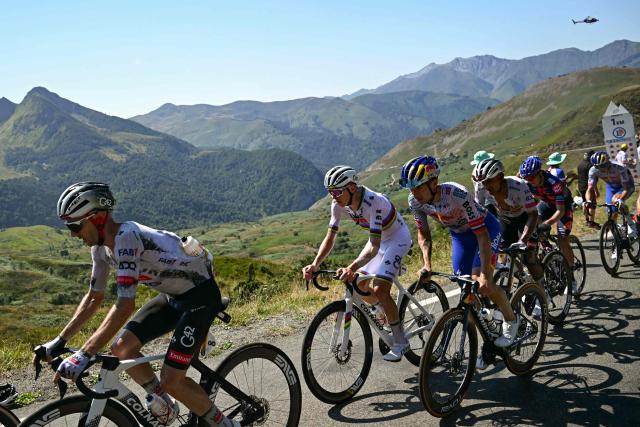 UAE Team Emirates - XRG team's British rider Adam Yates, UAE Team Emirates - XRG team's Slovenian rider Tadej Pogacar, Red Bull - BORA - hansgrohe team's Slovenian rider Primoz Roglic cycle in the ascent of Col des Borderes during the 12th stage of the 112th edition of the Tour de France cycling race, 180.6 km between Auch and Hautacam, in the Pyrenees mountains of southwestern France, on July 17, 2025. (Photo by Loic VENANCE / AFP)
