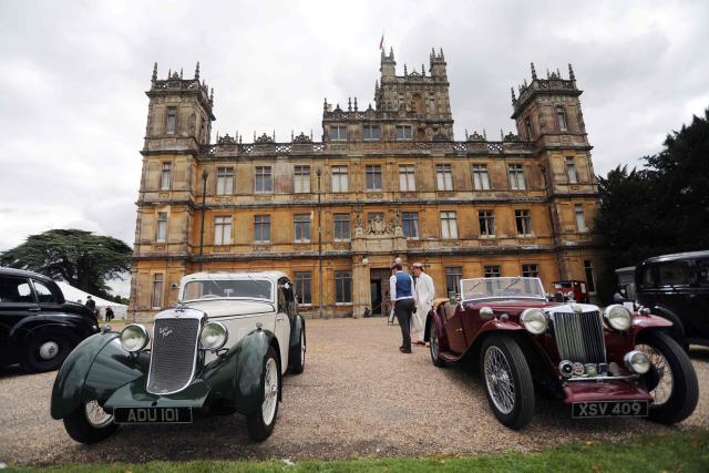 (FILES) Visitors attend a 1920's themed event at Highclere Castle, near Newbury, west of London, on September 7, 2019, ahead of the world premiere of the Downton Abbey film. Highclere Castle is the main set location of the British television series Downton Abbey, which has been turned into a film Franchise. Bonhams will hold an auction of memorablia from the TV show and films featuring everything from dresses to a clapper board, which will run online for just under a month from August 18. (Photo by Isabel INFANTES / AFP)