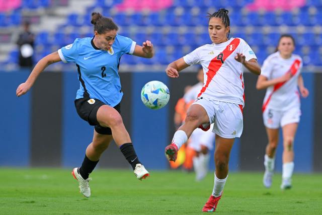Uruguay's defender #02 Stephanie Lacoste and Peru's forward #09 Pierina Nunez fight for the ball during the Women's Copa America 2025 football match between Uruguay and Peru at the IDV stadium in Quito on July 18, 2025. (Photo by Rodrigo BUENDIA / AFP)