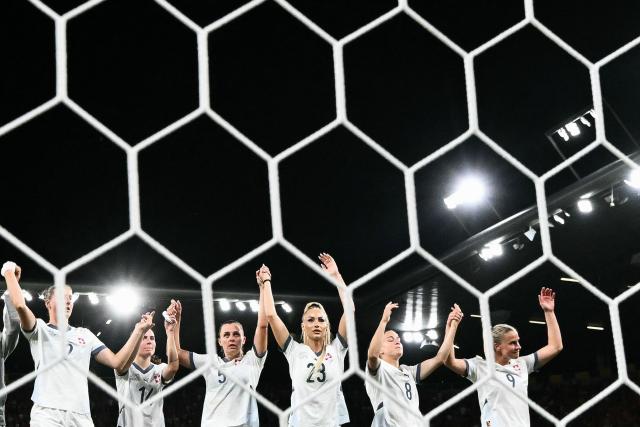 Switzerland's forward #23 Alisha Lehmann (C) and teammates greet fans after loosing the UEFA Women's Euro 2025 quarter finals football match between Spain and Switzerland at the Wankdorf stadium in Bern, northwestern Switzerland on July 18, 2025. (Photo by SEBASTIEN BOZON / AFP)