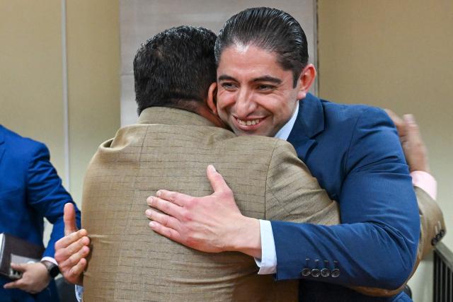 Former anti-corruption prosecutor Stuardo Campo reacts after listening to the sentence during a hearing at the Palace of Justice in Guatemala City on July 18, 2025. A criminal court in Guatemala acquitted three former anti-corruption prosecutors on Friday, who were accused of failing to fulfill their duties, victims of proceedings initiated by the prosecution, and criticized by the international community. (Photo by JOHAN ORDONEZ / AFP)