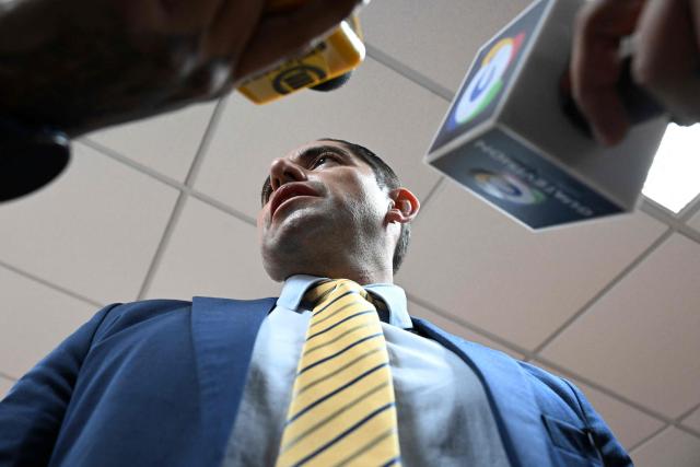 Former anti-corruption prosecutor Stuardo Campo speaks to the press after a hearing at the Palace of Justice in Guatemala City on July 18, 2025. A criminal court in Guatemala acquitted three former anti-corruption prosecutors on Friday, who were accused of failing to fulfill their duties, victims of proceedings initiated by the prosecution, and criticized by the international community. (Photo by JOHAN ORDONEZ / AFP)