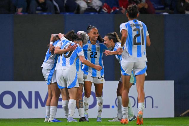 Argentina's defender #15 Maria Bonsegundo (Covered) celebrates with her teammates after scoring her team's second goal during the Women's Copa America 2025 football match between Ecuador and Argentina at the IDV stadium in Quito on July 24, 2025. (Photo by Rodrigo BUENDIA / AFP)