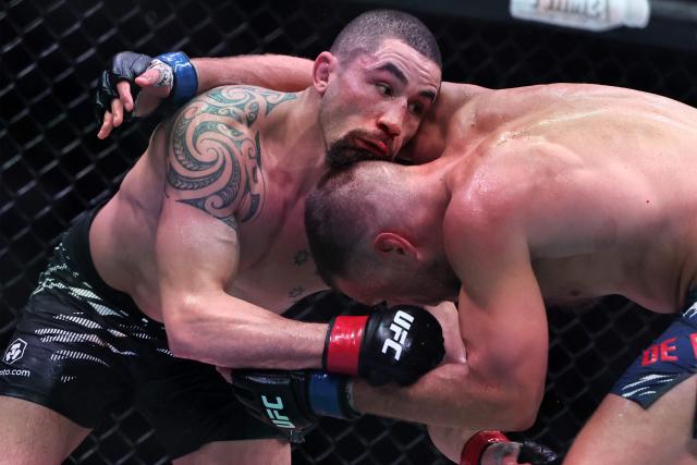 Australia and New Zealand's Robert Whittaker and the Netherlands' Reinier de Ridder compete in their men's middleweight fight at the UFC Fight Night event at Etihad Arena in Abu Dhabi on July 26, 2025. (Photo by Fadel SENNA / AFP)