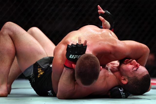 Australia and New Zealand's Robert Whittaker and the Netherlands' Reinier de Ridder compete in their men's middleweight fight at the UFC Fight Night event at Etihad Arena in Abu Dhabi on July 26, 2025. (Photo by Fadel SENNA / AFP)