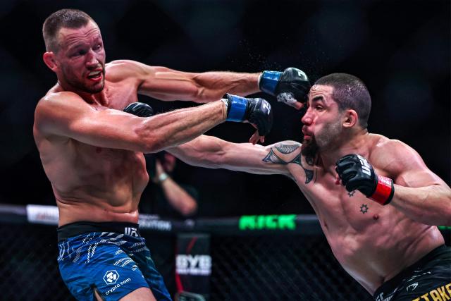 Australia and New Zealand's Robert Whittaker and the Netherlands' Reinier de Ridder compete in their men's middleweight fight at the UFC Fight Night event at Etihad Arena in Abu Dhabi on July 26, 2025. (Photo by Fadel SENNA / AFP)