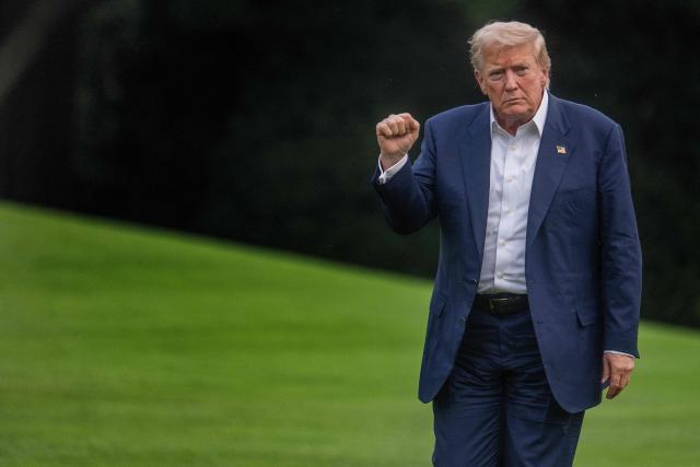 US President Donald Trump gestures as he arrives on the South Lawn of the White House in Washington, DC, on July 29, 2025. Trump returned to Washington following a trip to Scotland. (Photo by Jim WATSON / AFP)