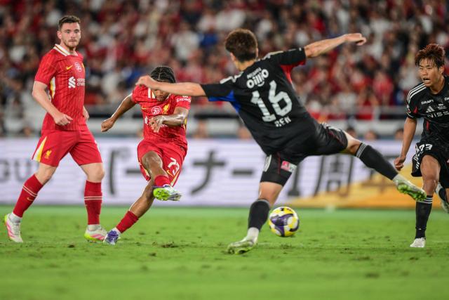 Liverpool's Rio Ngumoha (2nd L) scores a goal during the friendly football match between English Premier League side Liverpool and Japan's J-League team Yokohama F. Marinos in Yokohama on July 30, 2025. (Photo by Yuichi YAMAZAKI / AFP)