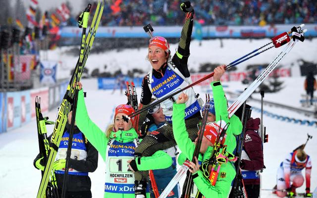 (FILES) German's Laura Dahlmeier (C, top) celebrates her victory with teammates in the finish area after the women 4x6 km relay at the FIS Biathlon World Championships in Hochfilzen on February 17, 2017. The former biathlon champion Dahlmeier died in the high mountains of Pakistan her agent said on July 30, 2025. A team of foreign climbers were on July 30, 2025 due to launch a rescue mission for German double biathlon champion Laura Dahlmeier, days after she was seriously injured by a rockfall on a Pakistani mountain.
The accident happened around midday on July 28, 2025 at an altitude of 5,700 metres on Laila Peak in the Karakoram range, according to a statement from her team on her official social media sites. (Photo by FRANCK FIFE / AFP)