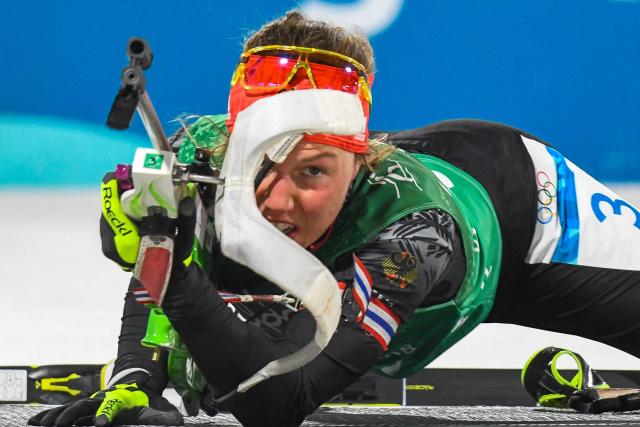 (FILES) Germany's Laura Dahlmeier competes at the shooting range in the mixed relay biathlon event during the Pyeongchang 2018 Winter Olympic Games on February 20, 2018, in Pyeongchang. German double biathlon champion Laura Dahlmeier was confirmed dead on July 30, 2025 after she was seriously injured by a rockfall on a Pakistani mountain. The dangerous nature of the site made rescue efforts "impossible", her agency said in a statement issued on July 30, 2025, which confirmed her death. "Rescue efforts to recover her failed and the operation was suspended," the statement continued. The accident happened around midday on July 28, 2025 at an altitude of 5,700 metres on Laila Peak in the Karakoram range, according to a statement from her team on her official social media sites. (Photo by François-Xavier MARIT / AFP)