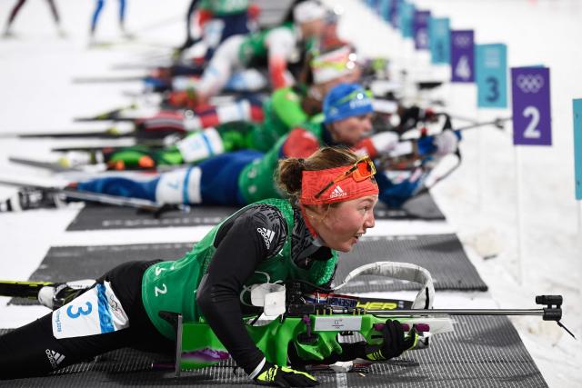 (FILES) Germany's Laura Dahlmeier competes at the shooting range in the mixed relay biathlon event during the Pyeongchang 2018 Winter Olympic Games on February 20, 2018, in Pyeongchang. German double biathlon champion Laura Dahlmeier was confirmed dead on July 30, 2025 after she was seriously injured by a rockfall on a Pakistani mountain. The dangerous nature of the site made rescue efforts "impossible", her agency said in a statement issued on July 30, 2025, which confirmed her death. "Rescue efforts to recover her failed and the operation was suspended," the statement continued. The accident happened around midday on July 28, 2025 at an altitude of 5,700 metres on Laila Peak in the Karakoram range, according to a statement from her team on her official social media sites. (Photo by Jonathan NACKSTRAND / AFP)
