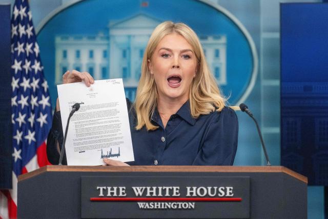 White House Press Secretary Karoline Leavitt displays a letter addressed to US pharmaceutical company Eli Lilly from President Donald Trump during the daily briefing in the Brady Briefing Room of the White House in Washington, DC, on July 31, 2025. (Photo by Jim WATSON / AFP)