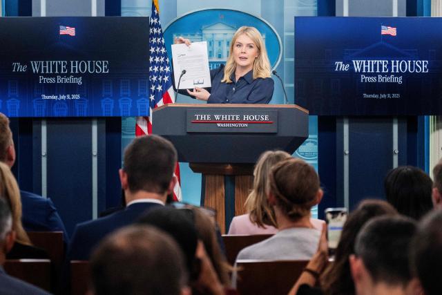 White House Press Secretary Karoline Leavitt displays a letter addressed to US pharmaceutical company Eli Lilly from President Donald Trump during a press briefing in the Brady Briefing Room of the White House in Washington, DC, on July 31, 2025. (Photo by Jim WATSON / AFP)