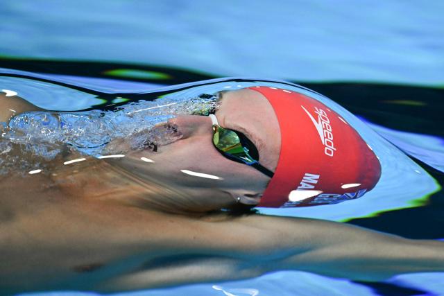 TOPSHOT - Britain's swimmer Jonathon Marshall competes in  a heat of the men's 50m backstroke swimming event during the 2025 World Aquatics Championships in Singapore on August 2, 2025. (Photo by Oli SCARFF / AFP)