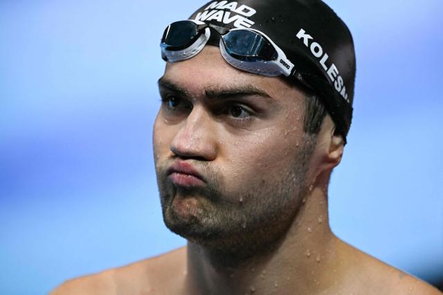 Neutral Athlete swimmer Kliment Kolesnikov reacts after a heat of the men's 50m backstroke swimming event during the 2025 World Aquatics Championships in Singapore on August 2, 2025. (Photo by Oli SCARFF / AFP)