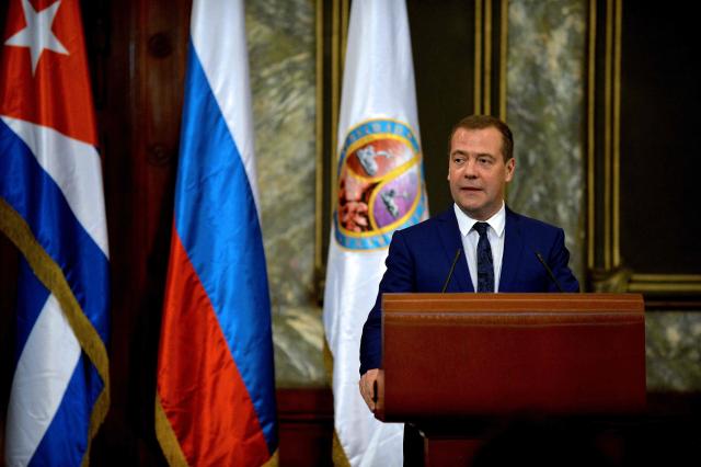 (FILES) Russian Prime Minister Dmitry Medvedev delivers a speech after receiving the title of Doctor Honoris Causa in Political Science at the Havana University, on October 4, 2019. A few years ago, he was considered a liberal reformer in the Kremlin. But former Russian President Dmitry Medvedev has stood out since the beginning of the invasion of Ukraine with his provocative statements, which eventually sparked Donald Trump's anger. (Photo by YAMIL LAGE / AFP)