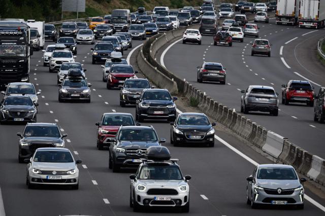 Vehicles are stuck in traffic on the A7 highway on the summer vacation route, near Chanas, during the first weekend of August of the French summer holiday season, on August 2, 2025. France has recorded heavy traffic congestion throughout the country on one of the busiest travel days of the year - known as the "Chasse-croise". (Photo by JEAN-PHILIPPE KSIAZEK / AFP)
