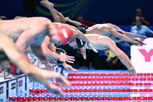 US' swimmer Jack Alexy starts the final of the men's 50m freestyle swimming event during the 2025 World Aquatics Championships in Singapore on August 2, 2025. (Photo by MANAN VATSYAYANA / AFP)