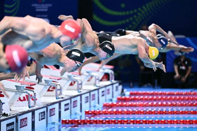 US' swimmer Jack Alexy starts the final of the men's 50m freestyle swimming event during the 2025 World Aquatics Championships in Singapore on August 2, 2025. (Photo by MANAN VATSYAYANA / AFP)