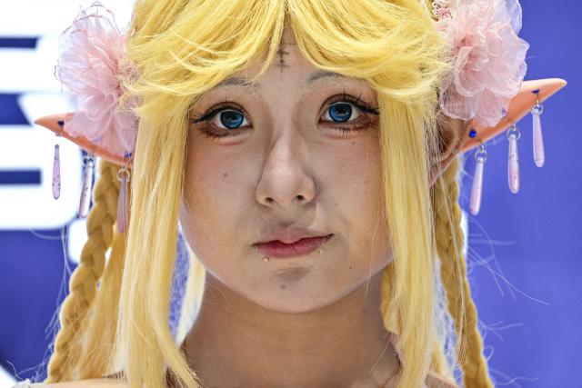 A cosplayer is seen during the China Digital Entertainment Expo and Conference known as ChinaJoy, at the Shanghai New International Expo Centre in Shanghai on August 4, 2025. (Photo by Hector RETAMAL / AFP)