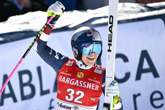 (FILES) USA's Lindsey Vonn reacts after her run in the Women's Downhill race as part of the FIS Alpine Ski World Cup in Sankt Anton am Arlberg, Austria, on January 11, 2025. Comeback queen Lindsey Vonn has appointed former Norwegian ski star Aksel Lund Svindal as coach to help her prepare for the 2026 Winter Olympics. The former Olympic and serial world champion stunned the sports world when she returned to the US ski team last year aged 40, five years after retirement. (Photo by Joe Klamar / AFP)