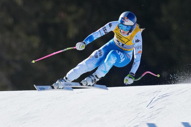 (FILES) US's Lindsey Vonn competes in the Women's Downhill event of the Saalbach 2025 FIS Alpine World Ski Championships in Hinterglemm on February 8, 2025. Comeback queen Lindsey Vonn has appointed former Norwegian ski star Aksel Lund Svindal as coach to help her prepare for the 2026 Winter Olympics. The former Olympic and serial world champion stunned the sports world when she returned to the US ski team last year aged 40, five years after retirement. (Photo by Dimitar DILKOFF / AFP)
