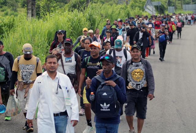 Around 300 migrants of different nationalities set out in a caravan from Tapachula, Chiapas state, Mexico, on August 6, 2025, heading to Mexico City to seek legal residency permits before continuing toward the US border. (Photo by Jose Torres / AFP)