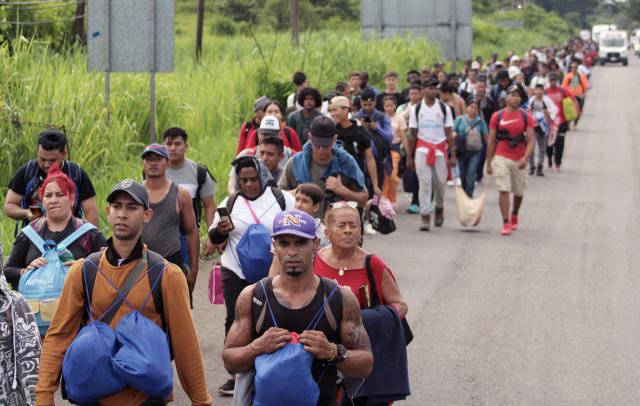 Around 300 migrants of different nationalities set out in a caravan from Tapachula, Chiapas state, Mexico, on August 6, 2025, heading to Mexico City to seek legal residency permits before continuing toward the US border. (Photo by Jose Torres / AFP)