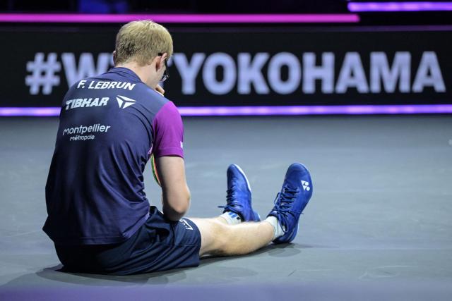 France's Felix Lebrun reacts after slipping on the court against South Korea's An Jae-hyun during their round-of-16 men's singles match at the WTT Champions Yokohama 2025 table tennis tournament in Yokohama, Kanagawa prefecture, south of Tokyo on August 9, 2025. (Photo by Richard A. Brooks / AFP)