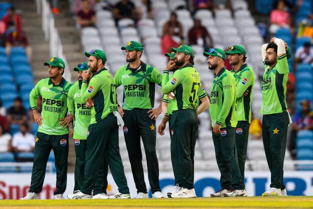 Pakistan players wait on the 3rd umpire decision during the second One Day International (ODI) cricket match between West Indies and Pakistan at Brian Lara Cricket Academy in Tarouba, San Fernando, Trinidad and Tobago on August 10, 2025. (Photo by Randy Brooks / AFP)