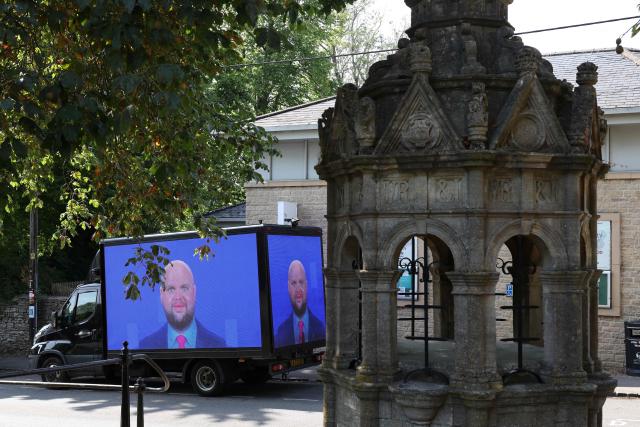 Memes of the vice president are displayed on a truck during a "Vance not welcome party", organised by Stop Trump Coalition supporters and local residents in  Charlbury, west of London on August 12, 2025, as the US Vice President JD Vance takes his vacation in the English countryside. Vance and his family are holidaying in the UK and are expected to spend some time in the Cotswolds region of southern England. (Photo by Darren Staples / AFP)