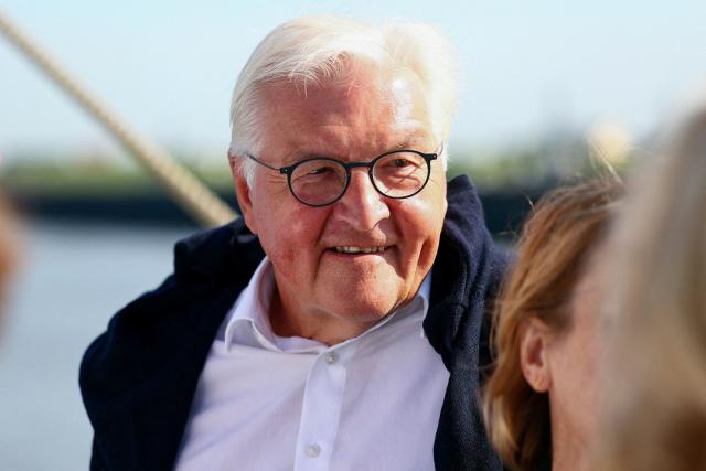 German President Frank-Walter Steinmeier stands onboard the German Navy training sailing ship 'Gorch Fock' during the maritime event "Sail Bremerhaven" in Bremerhaven, Germany, on August 13, 2025. (Photo by Leon Kuegeler / POOL / AFP)