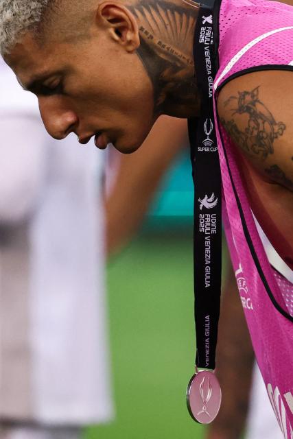 Tottenham Hotspur's Brazilian forward #09 Richarlison (R) reacts at the end of the 2025 UEFA Super Cup final football match between Paris Saint-Germain (FRA) and Tottenham Hotspur FC (ENG) at the Friuli stadium, in Udine, on August 13, 2025. (Photo by FRANCK FIFE / AFP)