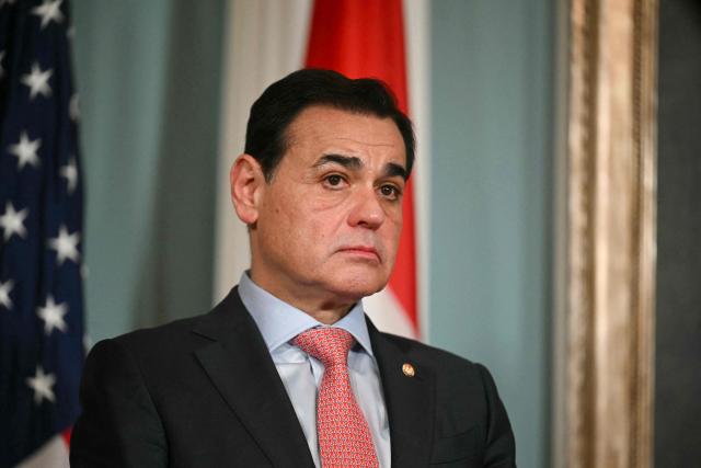 Foreign Minister of Paraguay Ruben Ramirez Lezcano looks on as US Secretary of State Marco Rubio speaks ahead of signing a memorandum of understanding in the Treaty Room of the State Department in Washington, DC, on August 14, 2025. (Photo by Jim WATSON / AFP)