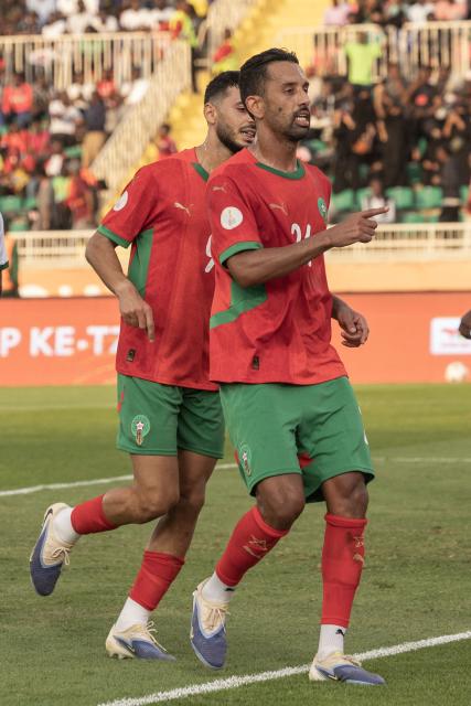 Morocco’s defender #24 Mohamed Rabie (R) celebrates with teammates after scoring his team's first goal during the African Nations Championship (CHAN) group stage football match between Morocco and Zambia at Nyayo Stadium in Nairobi on August 14, 2025. (Photo by SIMON MAINA / AFP)
