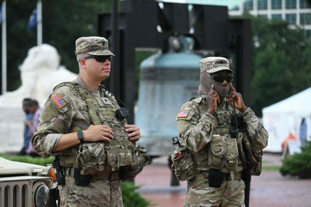 Members of the US National Guard patrol in front of Union Station in Washington, DC, on August 14, 2025. US President Donald Trump on August 11 deployed military and federal law enforcement to curb violent crime in Washington, as he seeks to make good on his campaign pledge to be a "law and order" president. The Republican leader said he would place the city's Metropolitan Police under federal government control while also sending the National Guard onto the streets of the US capital. (Photo by Jim WATSON / AFP)