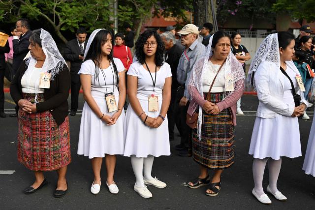 Catholic faithful take part in a parade to celebrate the day of the Virgin of the Assumption, the city's patron saint, in Guatemala City on August 15, 2025. (Photo by JOHAN ORDONEZ / AFP)