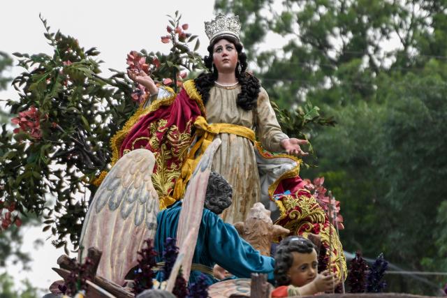 A statue of the Virgin of the Assumption, the city's patron saint, is seen during a parade in Guatemala City on August 15, 2025. (Photo by JOHAN ORDONEZ / AFP)