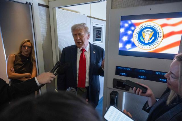 TOPSHOT - US President Donald Trump speaks to reporters aboard Air Force One in the air on August 15, 2025, en route to Anchorage. US President Donald Trump departed Washington en route to Alaska Friday for a high-risk summit with his Russian counterpart Vladimir Putin that could prove decisive for the future of Ukraine. (Photo by ANDREW CABALLERO-REYNOLDS / AFP)