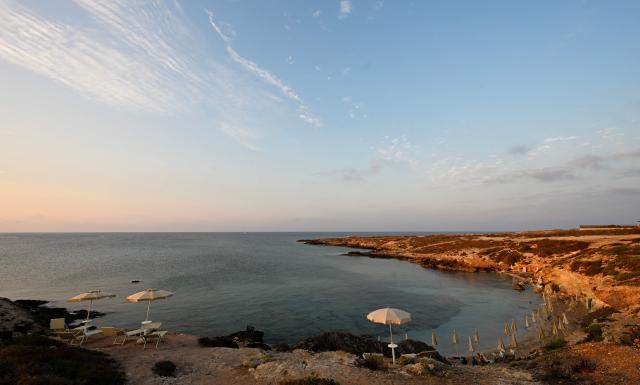 This photograph shows the "Cala Spugne" beach in Lampedusa, south Italy on August 16, 2025. (Photo by Stefano RELLANDINI / AFP)