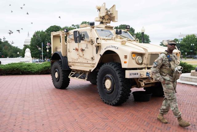 Members of the National Guard stand watch outside of Union Station in Washington, DC, under orders from the Trump administration on August 19, 2025. US President Donald Trump on August 11 deployed military and federal law enforcement to curb violent crime in Washington, as he seeks to make good on his campaign pledge to be a "law and order" president. The Republican leader said he would place the city's Metropolitan Police under federal government control while also sending the National Guard onto the streets of the US capital. (Photo by SAUL LOEB / AFP)