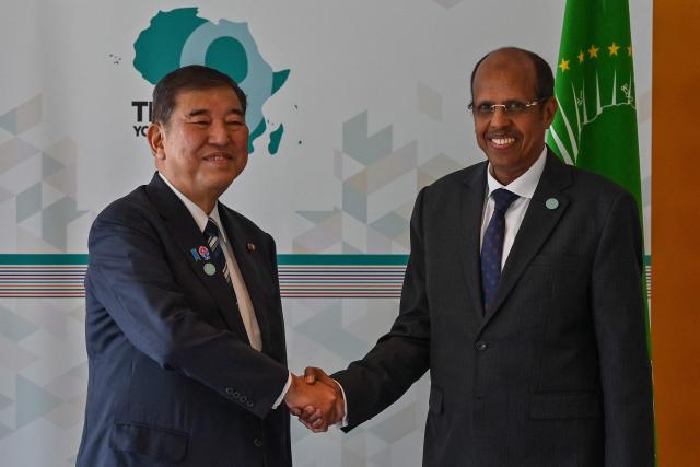 Japan's Prime Minister Shigeru Ishiba (L) meets with the chairperson of the African Union (AU), Angola's President Joao Lourenco, at their bilateral meeting on the sidelines of the 9th Tokyo International Conference on African Development (TICAD 9) in Yokohama, Kanagawa prefecture, south of Tokyo on August 20, 2025. (Photo by Richard A. Brooks / AFP)
