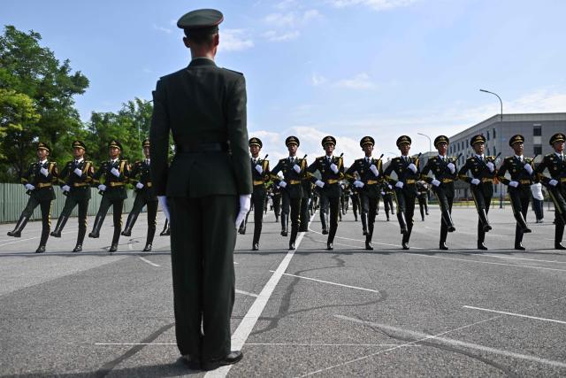 Chinese military personnel take part in a rehearsal ahead of the parade commemorating the 80th anniversary of the victory in the Chinese People's War of Resistance Against Japanese Aggression and the World Anti-Fascist War, which will be held on September 3, in Beijing on August 20, 2025. (Photo by Pedro PARDO / AFP)