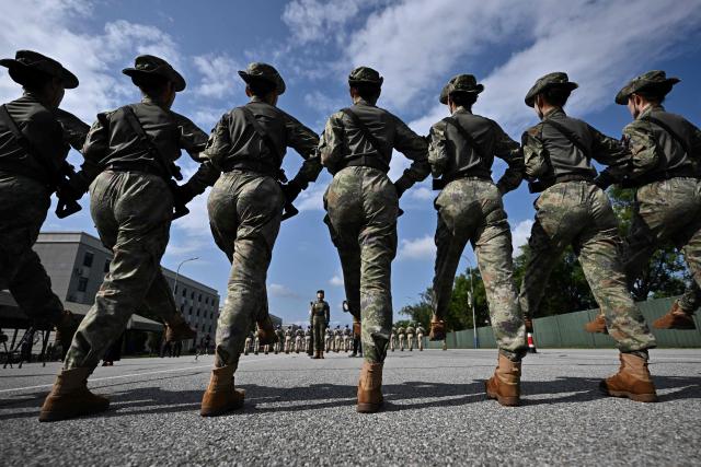 Chinese military personnel take part in a rehearsal ahead of the parade commemorating the 80th anniversary of the victory in the Chinese People's War of Resistance Against Japanese Aggression and the World Anti-Fascist War, which will be held on September 3, in Beijing on August 20, 2025. (Photo by Pedro PARDO / AFP)